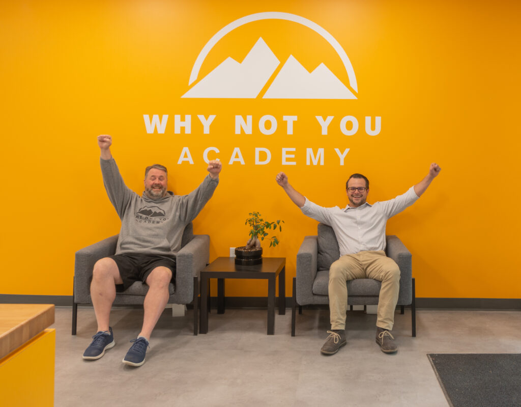 Scott Canfield and Garth Reeves in front of WNY Academy sign
